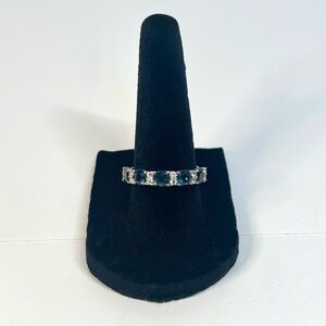 Sterling silver half eternity band with London blue and white topaz stones